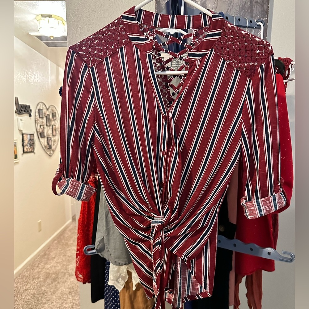 Red, blue and white button up blouse.